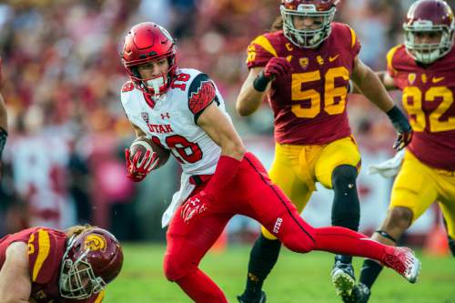 Chris Detrick  |  The Salt Lake Tribune
Utah Utes wide receiver Britain Covey (18) runs past USC Trojans linebacker Anthony Sarao (56) and USC Trojans tight end Tyler Petite (82) during the game at the Los Angeles Memorial Coliseum Saturday October 24, 2015.
