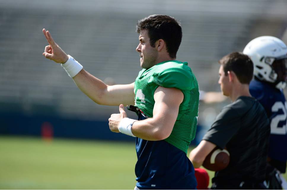 Scott Sommerdorf   |  The Salt Lake Tribune
BYU backup QB Tanner Mangum sends in signals from the sidelines during practice, Saturday, August 22, 2015.