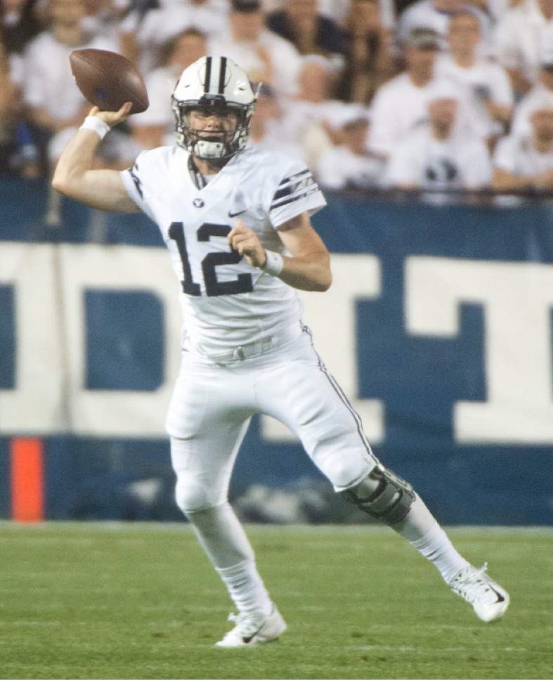 Rick Egan  |  The Salt Lake Tribune

Brigham Young Cougars quarterback Tanner Mangum (12) looks for an open man, in college football action, BYU vs. Boise State at Lavell Edwards Stadium, Saturday, Sept. 12, 2015.