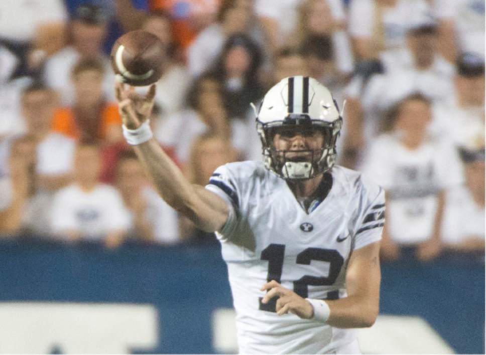 Rick Egan  |  The Salt Lake Tribune

Brigham Young Cougars quarterback Tanner Mangum (12) throws the ball, in college football action, BYU vs. Boise State at Lavell Edwards Stadium, Saturday, Sept. 12, 2015.