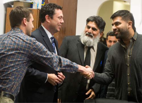 Rick Egan  |  The Salt Lake Tribune

Rep. Jason Chaffetz son Max shakes hands with Avais Ahmed (right) and Abdul Afridi (center) at the Khadeeja Islamic Center, Monday, December 14, 2015.