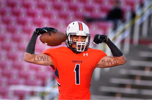 Scott Sommerdorf   |  The Salt Lake Tribune
Timpview WR Samson Nacua celebrates a first half 29yd TD to give Timpview a 14-13 lead. Timpview led Highland 21-19 at the half in a 4A semi-final game played at Rice-Eccles stadium, Thursday, November 12, 2015.