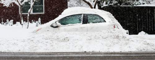 Steve Griffin  |  The Salt Lake Tribune

Snow covers a compact car in Salt Lake City as a major storm dumped snow through out the sate Monday, December 14, 2015.