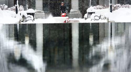 Steve Griffin  |  The Salt Lake Tribune

Snow removal crews work to keep the walkways at the Utah Sate Capitol cleat as a major storm dumped snow through out the sate in Salt Lake City, Monday, December 14, 2015.