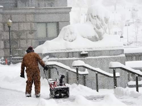 Steve Griffin  |  The Salt Lake Tribune

Snow removal crews work to keep the stairs at the Utah Sate Capitol cleat as a major storm dumped snow through out the sate in Salt Lake City, Monday, December 14, 2015.