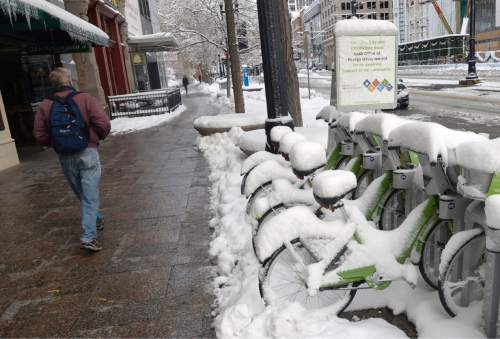 Al Hartmann  |  The Salt Lake Tribune
Green Bikes mounded up with snow in downtown Salt Lake City weren't going anywhere Tuesday morning Dec. 15 as the city digs out from yesterday's record breaking snowfall.