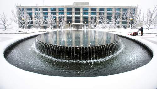 Steve Griffin  |  The Salt Lake Tribune

Snow removal crews work to keep the walkways at the Utah Sate Capitol cleat as a major storm dumped snow through out the sate in Salt Lake City, Monday, December 14, 2015.