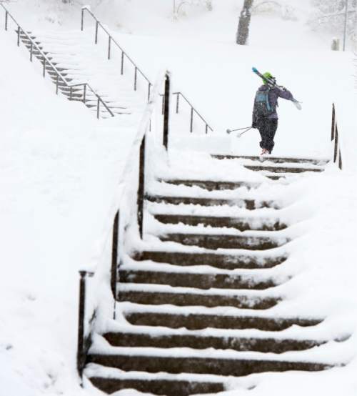 Steve Griffin  |  The Salt Lake Tribune

Snow removal crews work to keep the stairs at the Utah Sate Capitol cleat as a major storm dumped snow through out the sate in Salt Lake City, Monday, December 14, 2015.