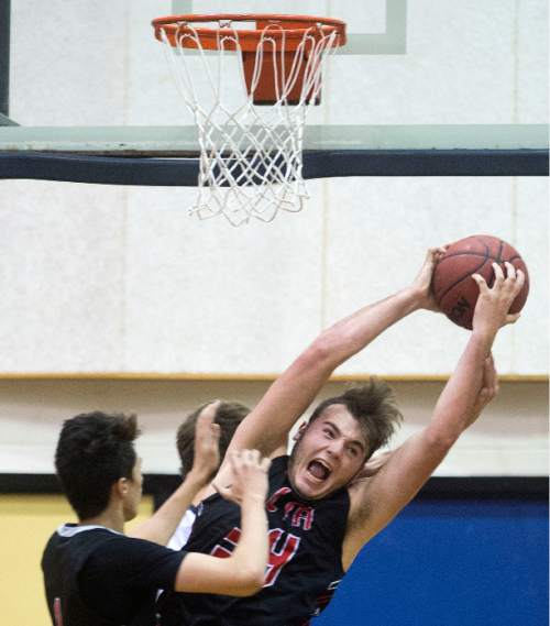 Steve Griffin  |  The Salt Lake Tribune

Alta's Jacob Armstrong stretches for a rebound during game against Skyline at Skyline High School in Salt Lake City, Tuesday, December 15, 2015.