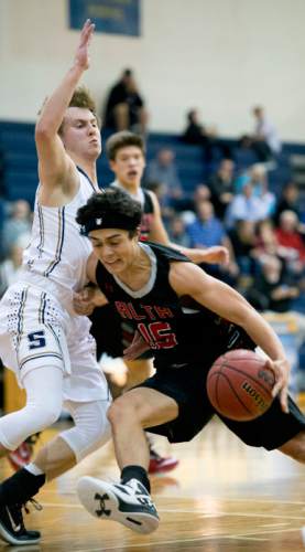 Steve Griffin  |  The Salt Lake Tribune

Alta's Marko Miholjcic gets blocked by Skyline's Spencer Thornley as he tries to dribble into the lane during game at Skyline High School in Salt Lake City, Tuesday, December 15, 2015.