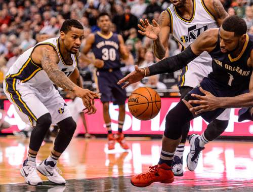 Trent Nelson  |  The Salt Lake Tribune
Utah Jazz guard Trey Burke (3) and New Orleans Pelicans guard Tyreke Evans (1) and a loose ball, as the Utah Jazz host the New Orleans Pelicans, NBA basketball in Salt Lake City, Wednesday December 16, 2015.
