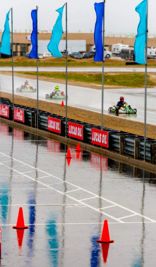 Trent Nelson  |  The Salt Lake Tribune
Heavy rain doesn't stop racers on the track for the Utah Kart Championship at Miller Motorsports Park, which kicked off its 2014 season with racing and a car show Saturday April 26, 2014.