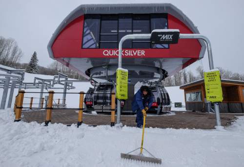 Francisco Kjolseth | The Salt Lake Tribune
Lift operator Nefi Urena readies Park City's new Quicksilver Gondola at Miners Camp restaurant that connects it with The Canyons for a grand opening celebration on Friday, Dec. 18, 2015.