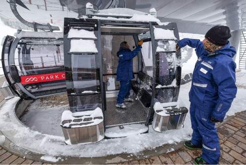 Francisco Kjolseth | The Salt Lake Tribune
Lift operators Nefi Urena, left, and Kyle Hudson ready Park City's new Quicksilver Gondola at Miners Camp restaurant that connects it with The Canyons for a grand opening celebration on Friday, Dec. 18, 2015.