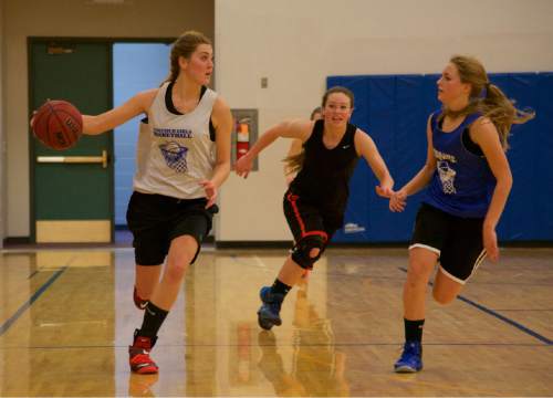 Lynn R. Johnson  | Special to the Tribune

Panguitch High School girls basketball team members, left to right, Chesney Campbell, Shantae Miller and Brittney Henrie, at a recent practice.