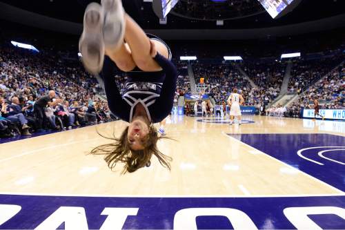 Scott Sommerdorf   |  The Salt Lake Tribune
BYU cheerleaders do flips for each made free throw during second half play as BYU defeated Central Michigan 98-85, Friday, December 18, 2015.