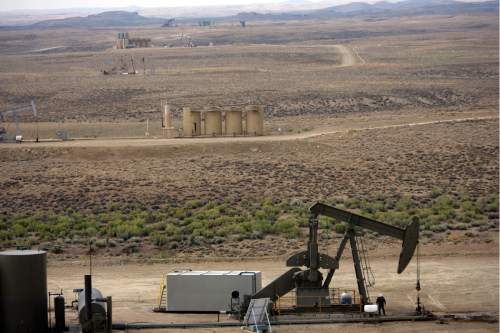 Kim Raff | The Salt Lake Tribune
Oil pumpers dot the landscape of Newfield Exploration Company's oil fields in Monument Butte near Roosevelt, Utah on August 9, 2012.