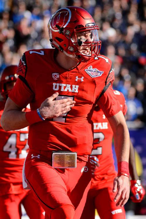 Trent Nelson  |  The Salt Lake Tribune
Utah Utes quarterback Travis Wilson (7) celebrates a touchdown as Utah faces BYU in the Royal Purple Las Vegas Bowl, NCAA football at Sam Boyd Stadium in Las Vegas, Saturday December 19, 2015.