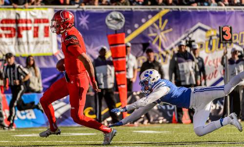 Trent Nelson  |  The Salt Lake Tribune
Utah Utes quarterback Travis Wilson (7) runs for a touchdown as Utah faces BYU in the Royal Purple Las Vegas Bowl, NCAA football at Sam Boyd Stadium in Las Vegas, Saturday December 19, 2015.