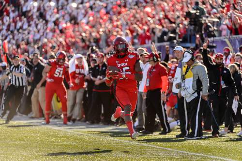 Trent Nelson  |  The Salt Lake Tribune
Utah Utes defensive back Dominique Hatfield (15) runs for a touchdown after an interception as Utah faces BYU in the Royal Purple Las Vegas Bowl, NCAA football at Sam Boyd Stadium in Las Vegas, Saturday December 19, 2015.