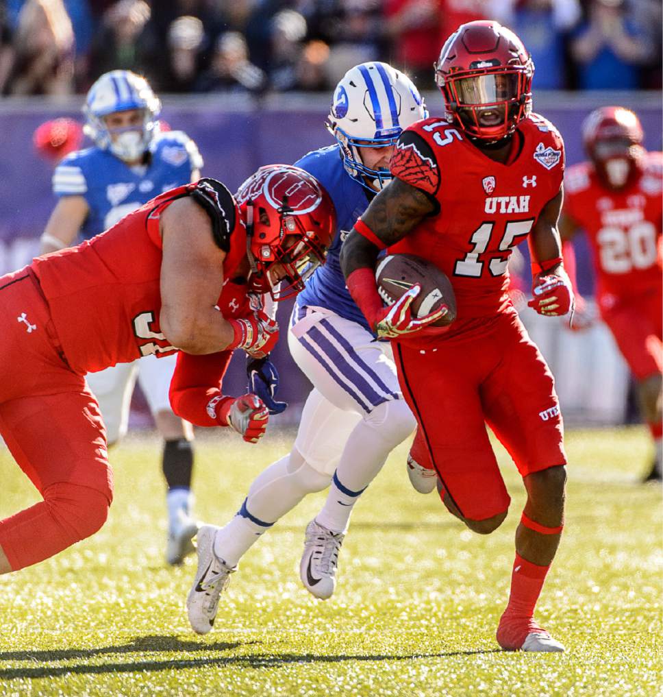 Trent Nelson  |  The Salt Lake Tribune
Utah Utes defensive back Dominique Hatfield (15) runs for a touchdown after an interception as Utah faces BYU in the Royal Purple Las Vegas Bowl, NCAA football at Sam Boyd Stadium in Las Vegas, Saturday December 19, 2015.