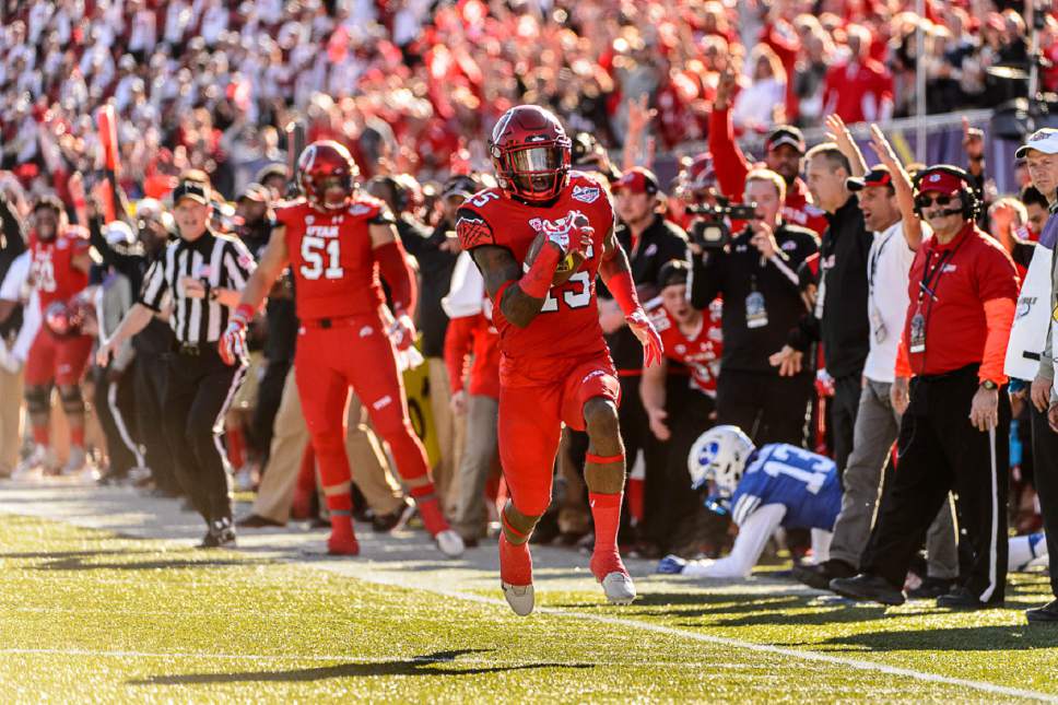 Trent Nelson  |  The Salt Lake Tribune
Utah Utes defensive back Dominique Hatfield (15) runs for a touchdown after an interception as Utah faces BYU in the Royal Purple Las Vegas Bowl, NCAA football at Sam Boyd Stadium in Las Vegas, Saturday December 19, 2015.