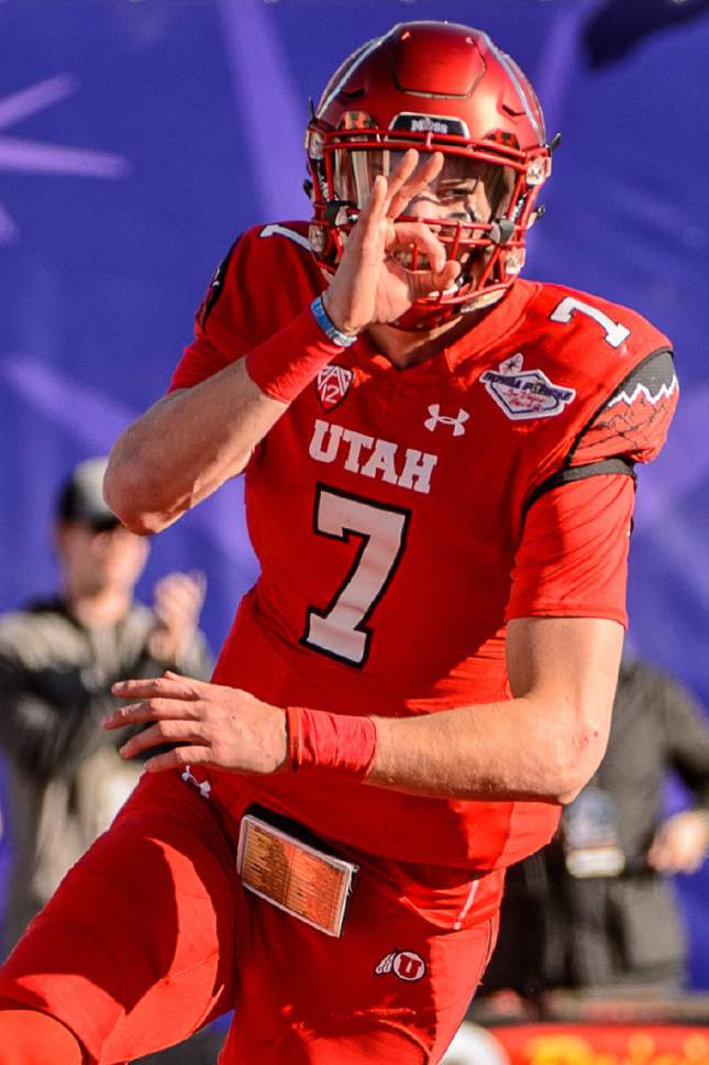 Trent Nelson  |  The Salt Lake Tribune
Utah Utes quarterback Travis Wilson (7) celebrates a touchdown as Utah faces BYU in the Royal Purple Las Vegas Bowl, NCAA football at Sam Boyd Stadium in Las Vegas, Saturday December 19, 2015.