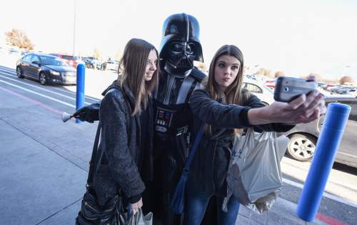Francisco Kjolseth  |  The Salt Lake Tribune
Everyone wants a selfie with Darth Vader. Like so many others, Mark Fordham of Provo became a Star Wars fan after seeing the first movie back in 1977. Soon after he created his first crude Darth Vader costume. Since those days he has become a regular charitable contributor to events as a member of the 501st Legion costuming club.