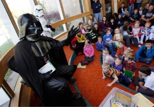 Francisco Kjolseth  |  Tribune file photo
Darth Vader and storm troopers will be at the Murray Library this Saturday to celebrate the traditional "May the Fourth Be With You" Star Wars Day.