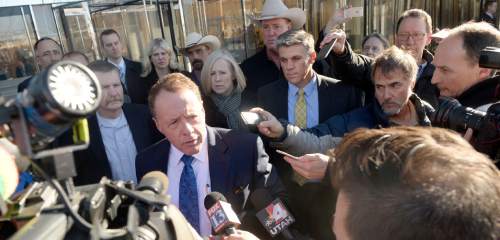 Al Hartmann  |  The Salt Lake Tribune
Peter Stirba, lawyer for San Juan County Commissioner Phil Lyman speaks to media after sentencing hearing in Federal Court in Salt Lake City Friday Dec. 18.  Lyman, behind, received 10 days in jail and three years probation for his role in an ATV protest ride down San Juan County's Recapture Canyon, which federal land managers closed to motorized use to protect ancient American Indian sites.