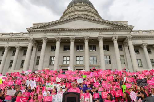 Leah Hogsten  |  The Salt Lake Tribune
Karrie Galloway, CEO of Planned Parenthood Action Council, giggles as the roar of the crowd drowns out her speech. The Utah Capitol was covered in pink August 25, 2015 as Planned Parenthood Action Council of Utah held a community rally and proponents of the family- planning organization gathered. Governor Gary Herbert has said the money that would have gone to Planned Parenthood will be redirected to 26 health agencies in the state in 49 locations. Planned Parenthood estimates it will lose $75,000 of STD testing and more than $100,000 for educational programs.