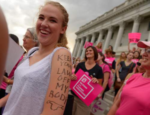Leah Hogsten  |  The Salt Lake Tribune
Chelsea Birkett, 17, a senior at Rowland-Hall is thankful for the members of the Planned Parenthood Teen Council for their sex education schooling. The Utah Capitol was covered in pink August 25, 2015 as Planned Parenthood Action Council of Utah held a community rally and proponents of the family- planning organization gathered. Governor Gary Herbert has said the money that would have gone to Planned Parenthood will be redirected to 26 health agencies in the state in 49 locations. Planned Parenthood estimates it will lose $75,000 of STD testing and more than $100,000 for educational programs.