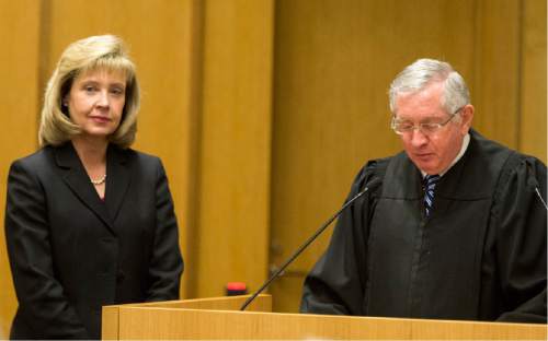 Rick Egan  |  The Salt Lake Tribune

Jill N. Parrish listens as Honorable Clark Waddoups reads the commission, during her investiture as a new federal judge, at the Federal Court Room, Monday, November 23, 2015.
