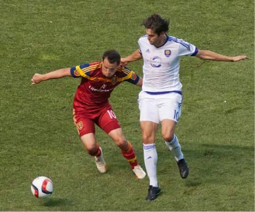 Michael Mangum  |  Special to the Tribune

Real Salt Lake midfielder Luis Gil (10) and Orlando City SC forward Kaka battle for possession during the first half of their match at Rio Tinto Stadium on Saturday, July 4, 2015.