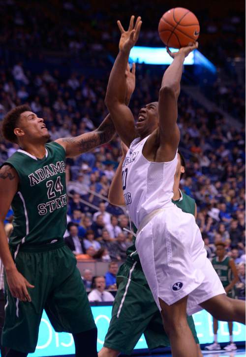 Leah Hogsten  |  The Salt Lake Tribune
Brigham Young Cougars forward Jamal Aytes (40) is fouled by Utah State Aggies forward Kendyl Grover (24) and Adams State Grizzlies guard Vitor Machado (1). Brigham Young University defeated Adams State Grizzlies, 97-56, November 20, 2015 at Marriott Center, Provo.