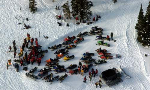Leah Hogsten  |  The Salt Lake Tribune
Utah Search and Rescue resumed their recovery operation for two to five people presumed to have been killed by an avalanche on Friday, January 14, 2005 in the area of Dutch's Draw, adjacent to The Canyons ski resort.