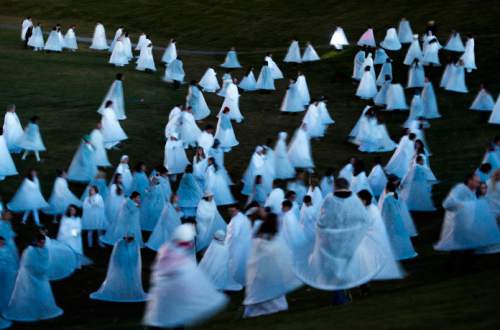 Steve Griffin  |  The Salt Lake Tribune

People dressed all in white and wearing their costumes which are lit by LED lights wait at Rock Canyon Park as they are joined by 1039 participants in an attempt to break a world record for a living nativity in Provo, Monday, December 1, 2014.