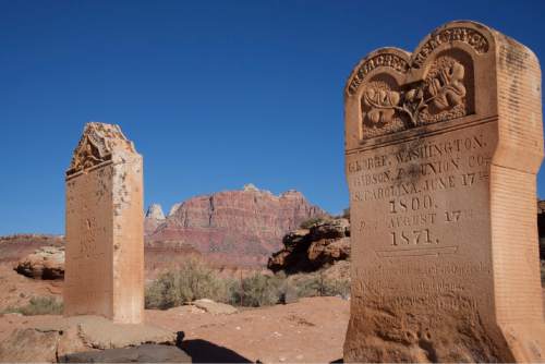 (Lynn R. Johnson / Special to The Salt Lake Tribune -- Nineteenth century grave markers at the historic Grafton Cemetery frame the southwest rim of Zion National Park in Southern Utah.