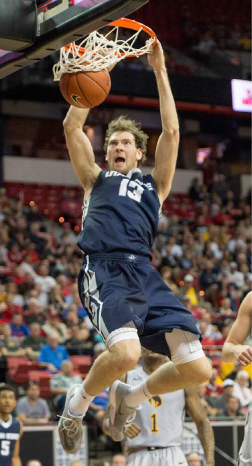 Rick Egan  |  The Salt Lake Tribune

Utah State forward David Collette (13) dunks the ball for the Aggies in Mountain West Conference Basketball Championship action, Utah State vs. Wyoming, at the Thomas & Mack Center in Las Vegas, Thursday, March 12, 2015.