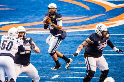 Chris Detrick  |  The Salt Lake Tribune
Utah State Aggies quarterback Chuckie Keeton (16) looks to pass the ball during the Famous Idaho Potato Bowl at Albertsons Stadium in Boise, Idaho Tuesday December 22, 2015.  Akron Zips defeated Utah State Aggies 23-21.
