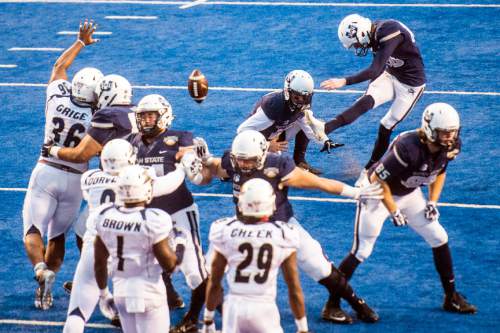 Chris Detrick  |  The Salt Lake Tribune
Utah State Aggies place kicker Brock Warren (63) kicks a  field goal during the Famous Idaho Potato Bowl at Albertsons Stadium in Boise, Idaho Tuesday December 22, 2015.  Akron Zips defeated Utah State Aggies 23-21.