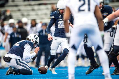 Chris Detrick  |  The Salt Lake Tribune
Utah State Aggies place kicker Brock Warren (63) can't make the kick as the ball if bobbled during the Famous Idaho Potato Bowl at Albertsons Stadium in Boise, Idaho Tuesday December 22, 2015.  Akron Zips lead Utah State Aggies 13-7 at halftime.