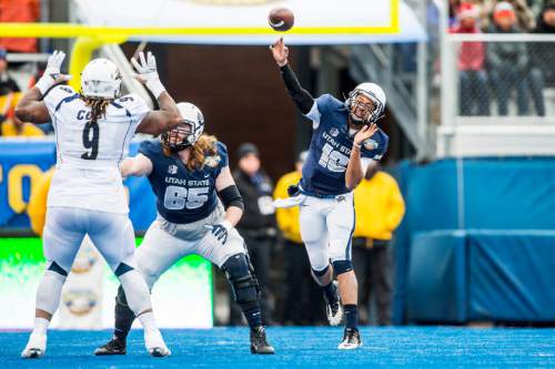 Chris Detrick  |  The Salt Lake Tribune
Utah State Aggies quarterback Chuckie Keeton (16) passes the ball during the Famous Idaho Potato Bowl at Albertsons Stadium in Boise, Idaho Tuesday December 22, 2015.  Akron Zips lead Utah State Aggies 13-7 at halftime.