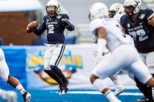 Chris Detrick  |  The Salt Lake Tribune
Utah State Aggies quarterback Kent Myers (2) looks to pass the ball during the Famous Idaho Potato Bowl at Albertsons Stadium in Boise, Idaho Tuesday December 22, 2015.  Akron Zips lead Utah State Aggies 13-7 at halftime.