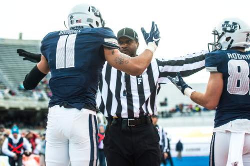 Chris Detrick  |  The Salt Lake Tribune
Utah State Aggies wide receiver Brandon Swindall (11) argues a call after during the Famous Idaho Potato Bowl at Albertsons Stadium in Boise, Idaho Tuesday December 22, 2015.  Akron Zips lead Utah State Aggies 13-7 at halftime.