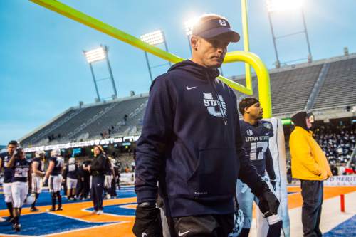 Chris Detrick  |  The Salt Lake Tribune
Utah State Aggies head coach Matt Wells walks off of the field after the Famous Idaho Potato Bowl at Albertsons Stadium in Boise, Idaho Tuesday December 22, 2015.  Akron Zips defeated Utah State Aggies 23-21.