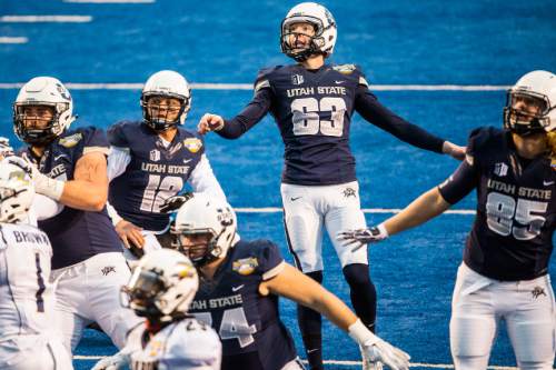 Chris Detrick  |  The Salt Lake Tribune
Utah State Aggies place kicker Brock Warren (63) watches his field goal during the Famous Idaho Potato Bowl at Albertsons Stadium in Boise, Idaho Tuesday December 22, 2015.  Akron Zips defeated Utah State Aggies 23-21.
