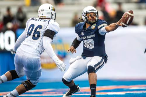 Chris Detrick  |  The Salt Lake Tribune
Utah State Aggies quarterback Chuckie Keeton (16) passes the ball during the Famous Idaho Potato Bowl at Albertsons Stadium in Boise, Idaho Tuesday December 22, 2015.  Akron Zips lead Utah State Aggies 13-7 at halftime.