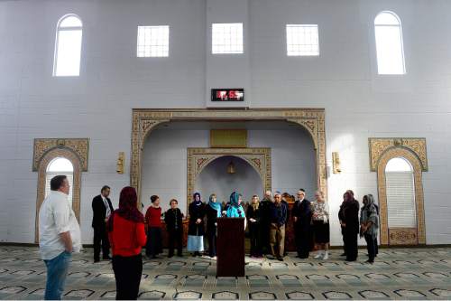 Scott Sommerdorf   |  The Salt Lake Tribune
A news conference at Khadeeja Islamic Center in West Valley City, Thursday, December 17, 2015.
Noor Ul-Hasan and invited politicos and other interfaith reps joined together to announce "Wear a Hijab" and other headgear on Friday as a show of support for Muslims.