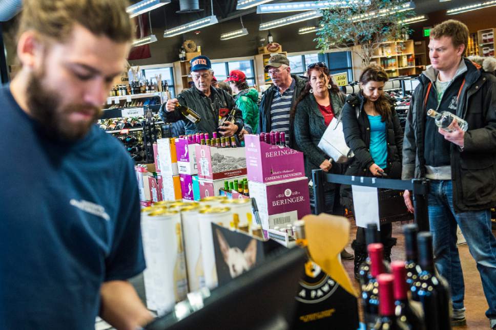 Chris Detrick  |  The Salt Lake Tribune
Customers wait in line to check out at the Utah Wine Store on 280 Harris Avenue Thursday December 24, 2015.